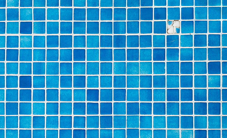 Square blue tiles with one broken