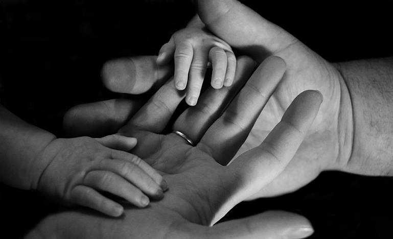 Child and parent holding hands