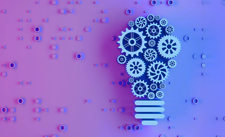 A set of gears grouped to form a lightbulb.