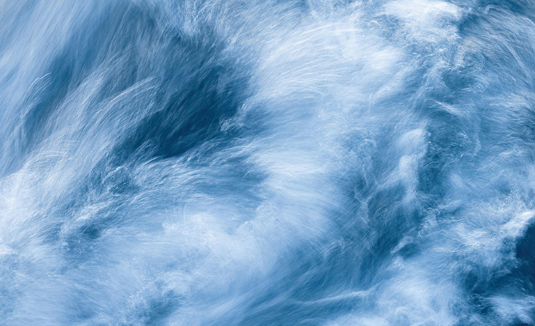 An aerial view of a churning ocean.