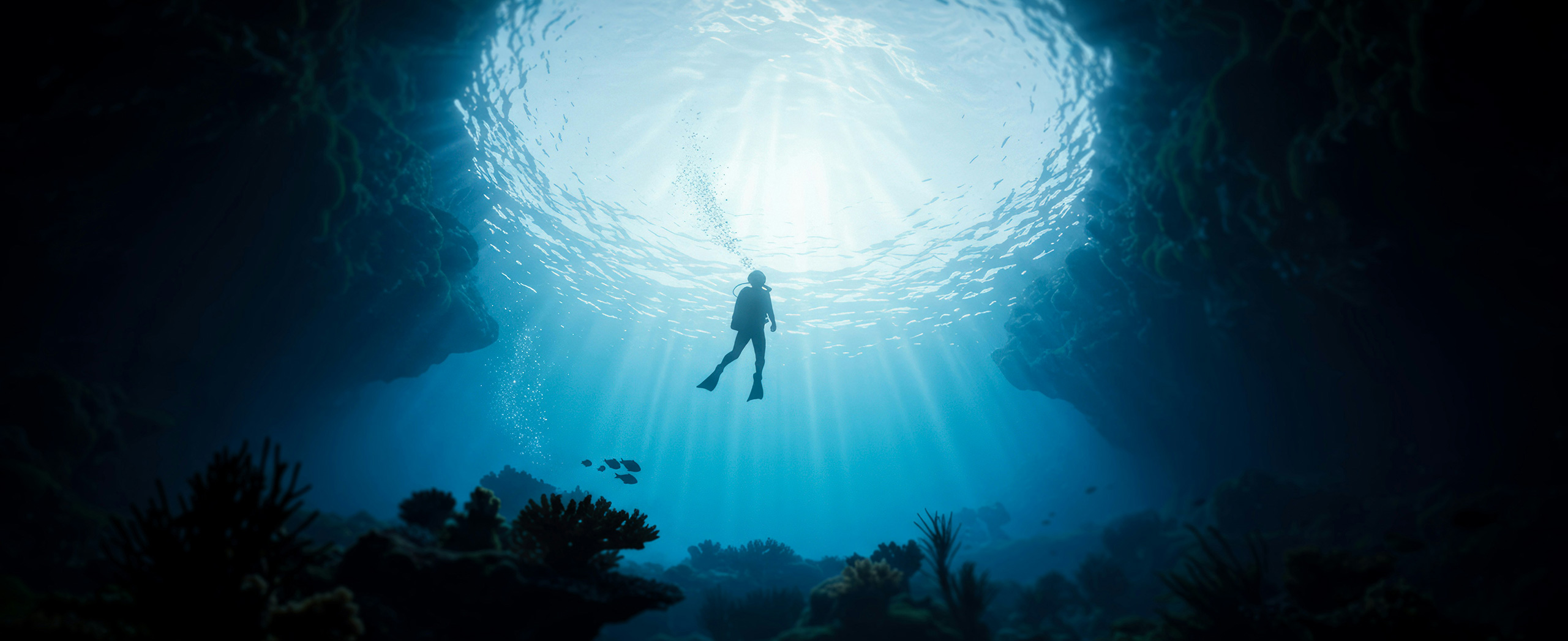 A scuba diver swimming in the ocean. 
