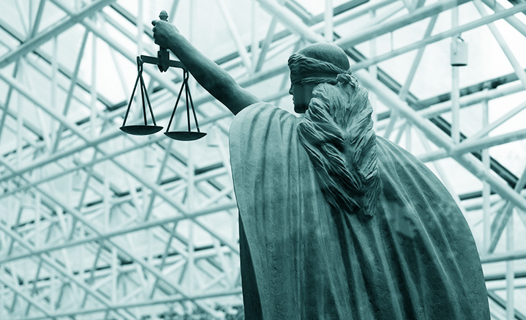 The goddess Themis holding the scales of justice at the Vancouver Law Courts.