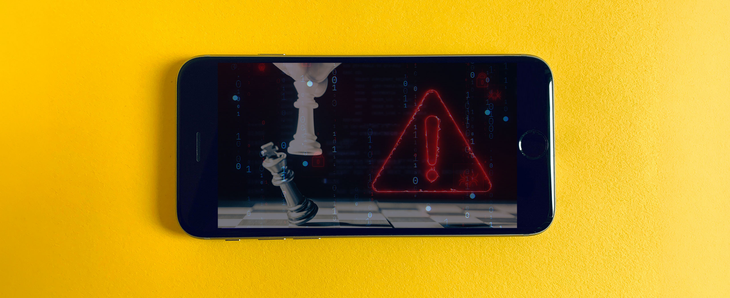 A smartphone with an image of chess and an alarm symbol.