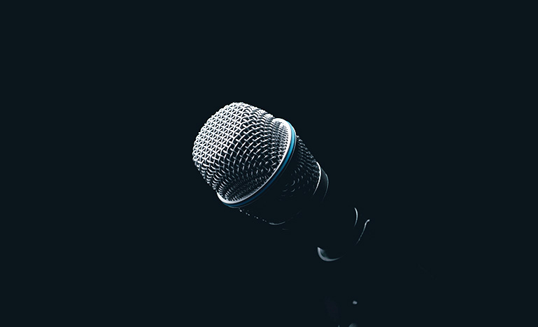 Microphone against black background