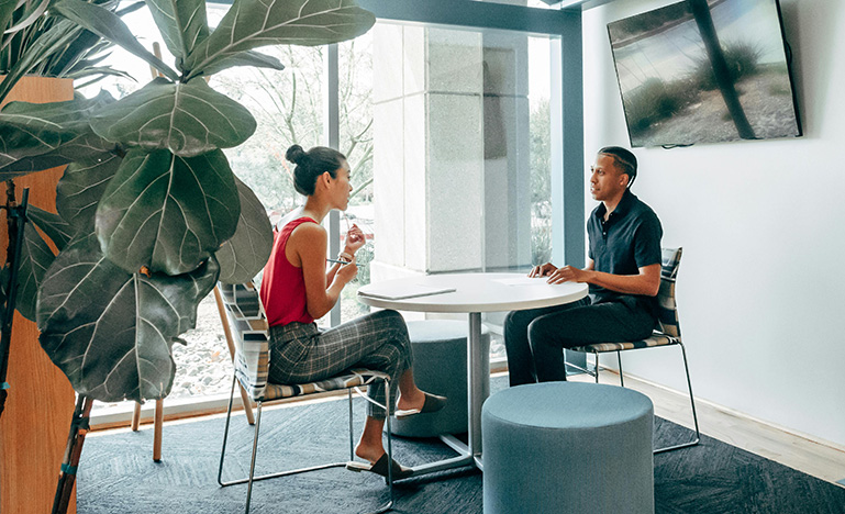 Two people having a job interview in a modern office.