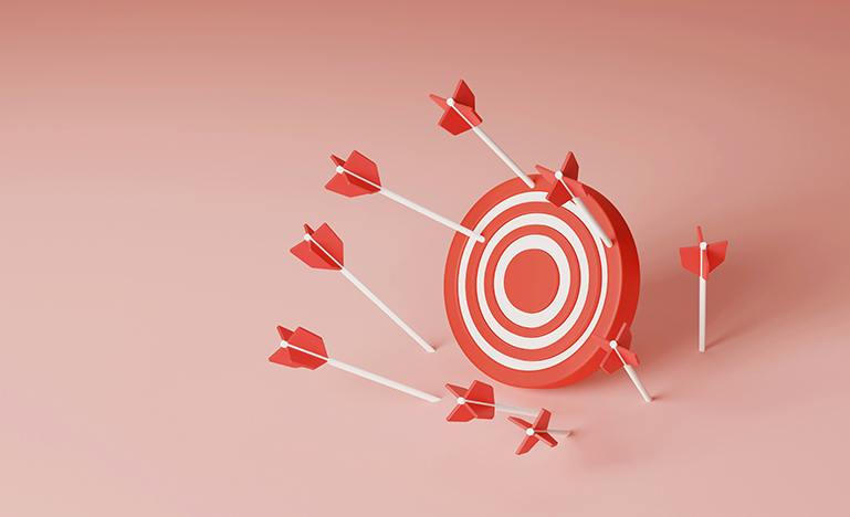 Several arrows landing around a target, all missing the bullseye.