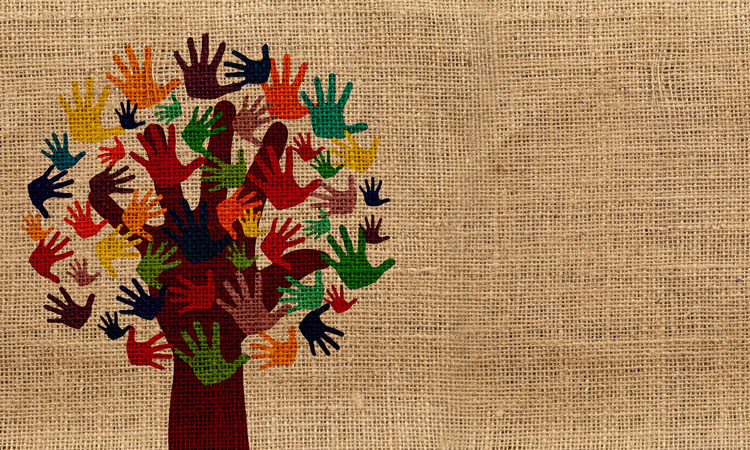 Tree with a handprint for a trunk and coloured leaves in the shape of handprints printed on beige weaved fabric
