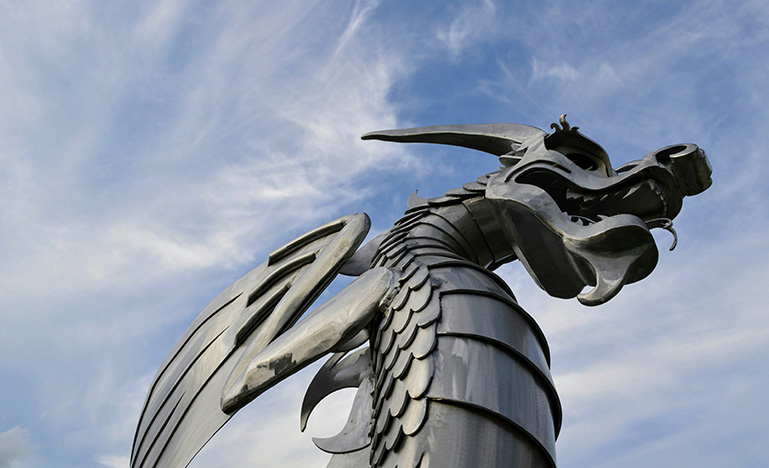 A large metal sculpture of a dragon.