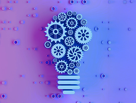 A set of gears grouped to form a lightbulb.