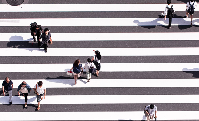 People walking on striped crosswalk