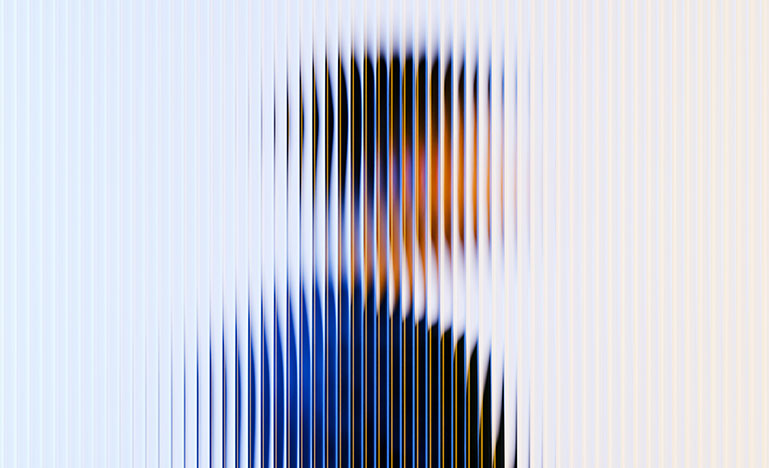 A person standing behind a blurred window.