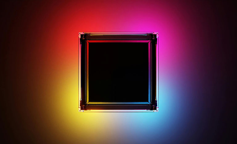 A black square in front of red, pink, yellow, and blue colour blocks