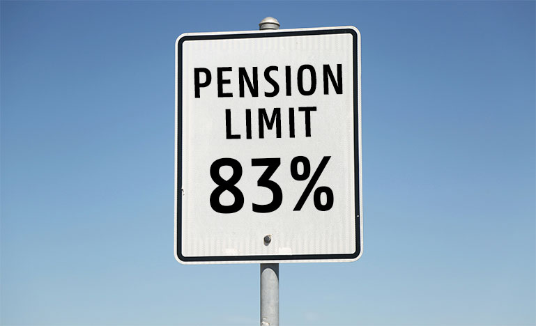 A road sign that reads "Pension Limit 83%"
