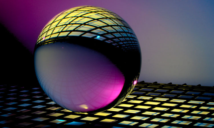 Reflective purple sphere on grate